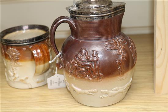 A Stoneware silver mounted jug and a matching mug, height 21cm